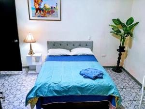 Ένα ή περισσότερα κρεβάτια σε δωμάτιο στο Miraflores Private Rooms