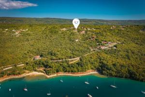 a hot air balloon flying over a body of water at Seaview Pool House Mytilus - Happy Rentals in Trgetari