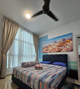 a bedroom with a bed with a ceiling fan at Premium Suite Vista Alam Seksyen 14 Shah Alam in Shah Alam