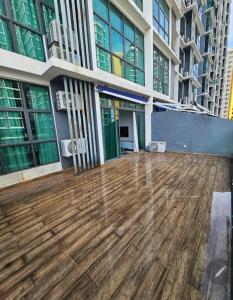 a wooden deck in the middle of a building at Premium Suite Vista Alam Seksyen 14 Shah Alam in Shah Alam