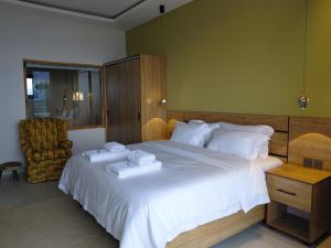 Postel nebo postele na pokoji v ubytování RUBONA HILL Lodge