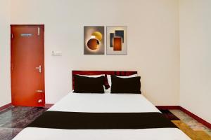 Ένα ή περισσότερα κρεβάτια σε δωμάτιο στο SPOT ON Sj Comforts Boarding And Lodging +20 φωτογραφίες