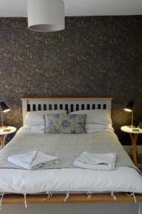 Postel nebo postele na pokoji v ubytování Hiraeth Homestay xxx