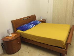 A bed or beds in a room at Sacca House