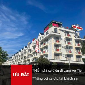 a large white building with a sign in front of it at LAS VEGAS HOTEL in Quang Ninh