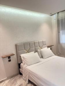 Ένα ή περισσότερα κρεβάτια σε δωμάτιο στο Zahra home centre ville TGV