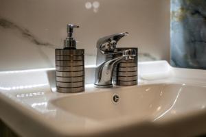 a bathroom sink with a faucet on top of it at Luna in Kalymnos