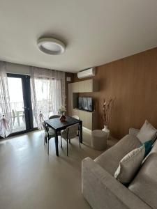 a living room with a couch and a table at Colle del Mare in Gabicce Mare