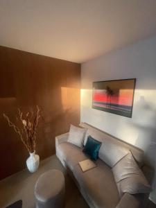 a living room with a couch and a chair at Colle del Mare in Gabicce Mare