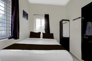 Postel nebo postele na pokoji v ubytování Hotel O ELITE STAY