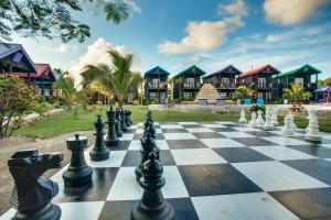 a chess board in front of a resort at X'tan Ha- The Waterfront in San Pedro