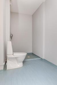 a bathroom with a toilet in a white room at Newly Furnished Apartment Kopparberg Train Station in Kopparberg