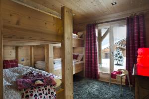 Ένα ή περισσότερα κρεβάτια σε δωμάτιο στο Chalet Nanook charme luxe Pyrénéen