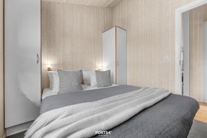 Ένα ή περισσότερα κρεβάτια σε δωμάτιο στο Ferienhaus Poolhaus Schönhagen