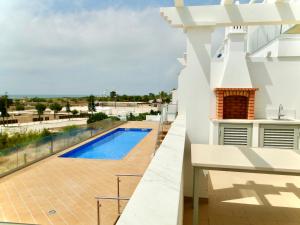 a view from the balcony of a house with a swimming pool at Pérola do Oceano in Manta Rota