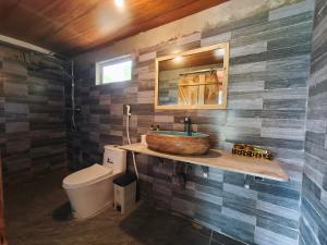a bathroom with a sink and a toilet at Hagiang Joy's retreat 