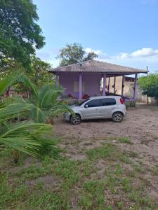 a car parked in front of a house at Casa Brisa do Tapajós in Santarém