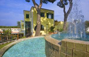 a water fountain in front of a house at Albergo Villa Hibiscus in Forio d'Ischia
