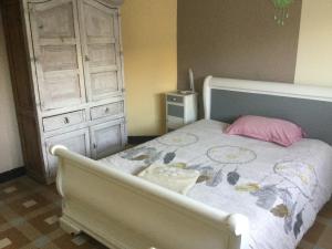 a bedroom with a bed with a dresser and a bed sidx sidx at Chez Lilly in Avignon