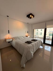 Giường trong phòng chung tại Departamento Frente al Mar