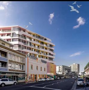 a rendering of a city street with a building at Kkape Sands - Peak Views From Sea Point Pad in Cape Town