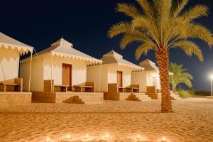 a rendering of a house with a palm tree at Desert Popular Resort & Camp in Jaisalmer