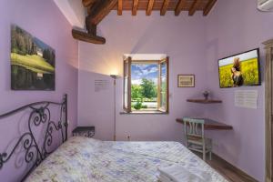 Postel nebo postele na pokoji v ubytování B&B Il Giardino dei Poeti and Apartaments