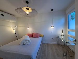 En eller flere senge i et værelse på GAVIA- Suite LUXURY - Go easy Down town