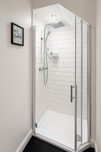 a shower with a glass door in a bathroom at LT 0 - Studio Apartment in Leicester