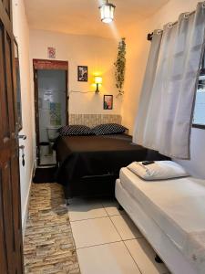 Ένα ή περισσότερα κρεβάτια σε δωμάτιο στο Hostel Uai