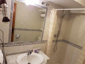 a bathroom with a sink and a shower at La Vista de Gredos in Navarredonda de Gredos +29 photos