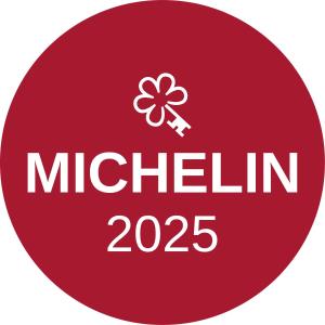 a red circle with the text michilin at Boutiquehotel 't Fraeyhuis - adults only in Bruges
