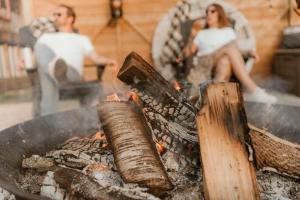 a man and a woman sitting next to a grill at The Klinck House in Collingwood +55 photos