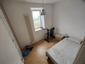 a bedroom with a bed and a window at Nuovo Progetto A&E in Vicenza +14 photos