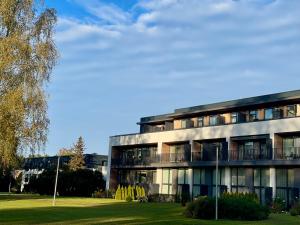 a large building with a lot of windows at MuunLiving in Ķesterciems
