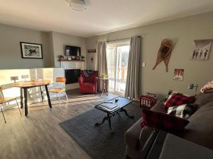a living room with a couch and a table at The Klinck House in Collingwood