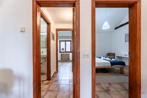 a hallway with two doors leading to a bedroom at Mare a due passi- Free WiFi - Relax - Smart TV in Savona