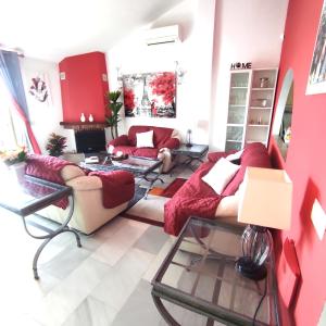 a living room with two couches and a fireplace at Paraíso del mar- Villa privada con piscina propia y vista al mar cerca de la playa in Fuengirola