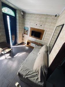 a bedroom with a large bed in a room at Charming Bahia House in Pelourinho in Salvador
