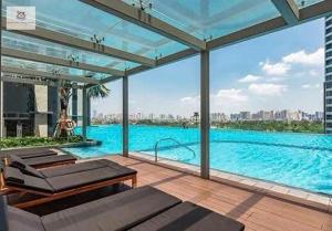a large swimming pool with a view of a city at Landmark 81 Sky blue Luxury Residence in Ho Chi Minh City