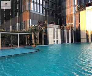 a large swimming pool in front of a building at Landmark 81 Sky blue Luxury Residence in Ho Chi Minh City