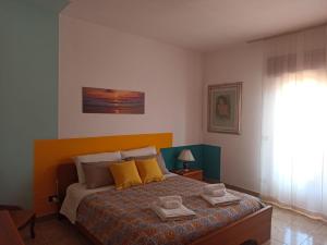 Ένα ή περισσότερα κρεβάτια σε δωμάτιο στο La Casa Sicula
