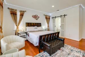 a bedroom with a large bed and a chair at Take Metro to DC! Family Home in Springfield in Franconia