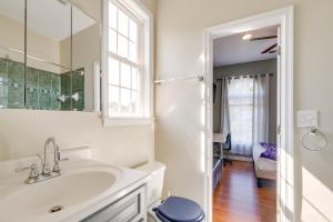 a white bathroom with a sink and a mirror at Take Metro to DC! Family Home in Springfield in Franconia +21 photos