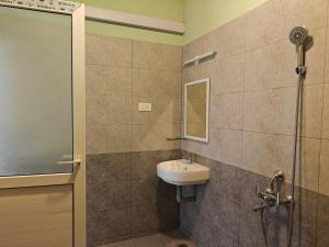 a bathroom with a sink and a shower at Maple Dreams Retreat- A Pool side Villa in Pondicherry +20 photos