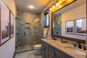 a bathroom with a sink and a shower and a toilet at Overlook Nook at Eagles Nest in Elk Park +45 photos