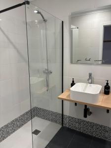 a bathroom with a sink and a shower at Origen Bed and Breakfast in Villargordo del Cabriel +49 photos