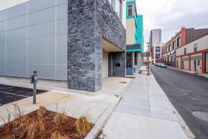 an empty city street with a stone building at Blueground Central Square rooftop nr Harvard BOS-1258 in Cambridge