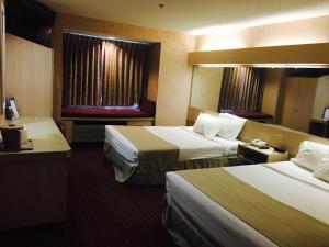 Postel nebo postele na pokoji v ubytování Microtel Inn & Suites by Wyndham Syracuse Baldwinsville