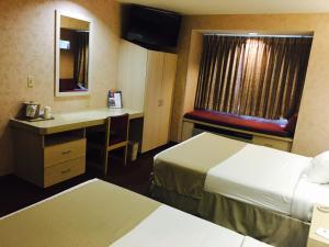 Postel nebo postele na pokoji v ubytování Microtel Inn & Suites by Wyndham Syracuse Baldwinsville